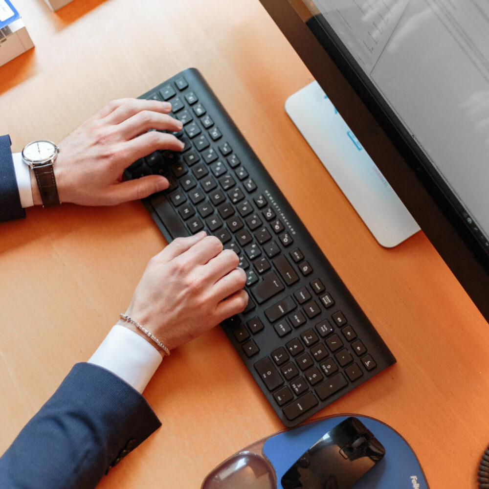 Business Man Working business man typing on a computer
